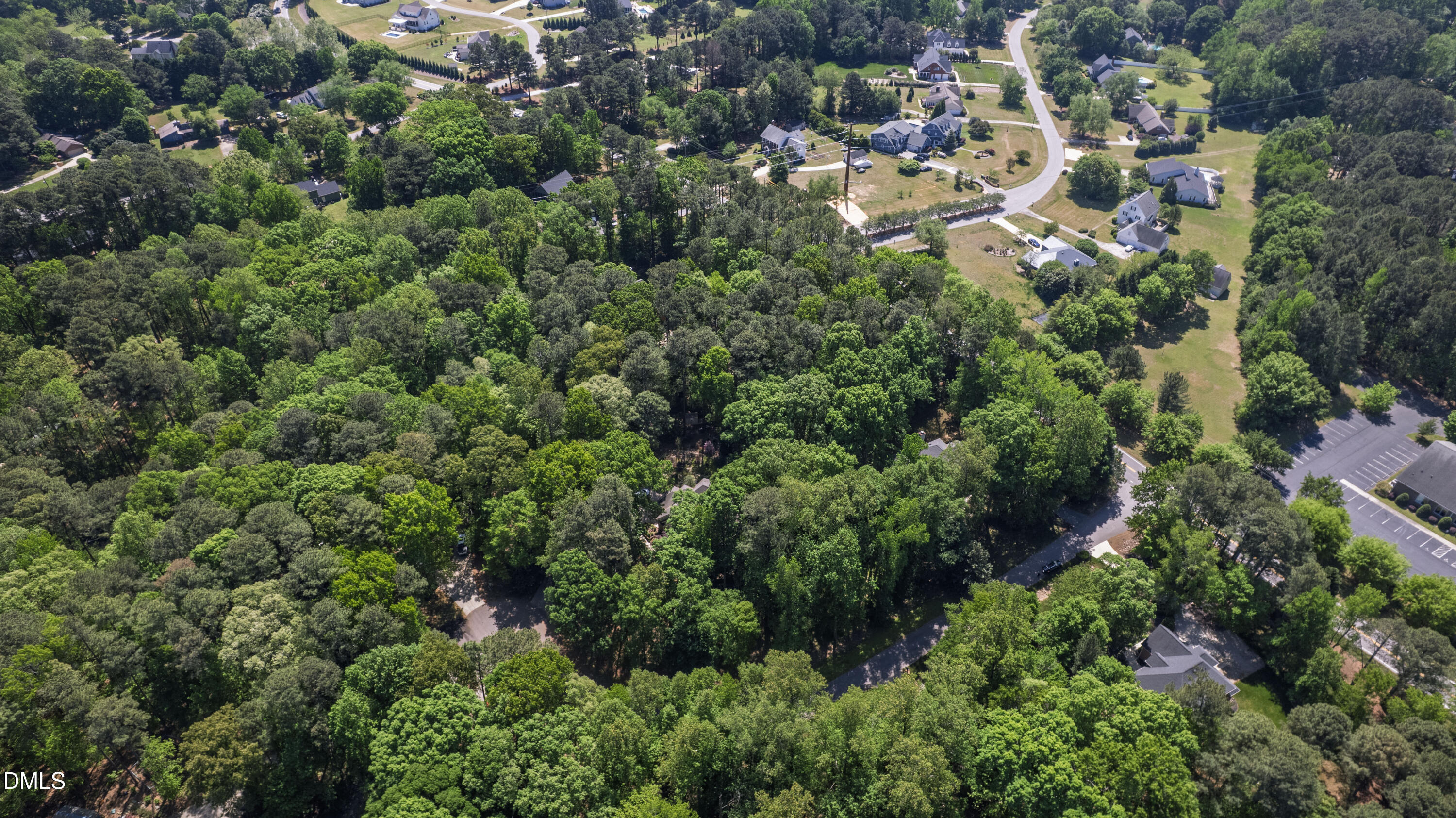 2721 Glassman Lane Raleigh, NC 27606 - Photo 70 of 74 an aerial view of residential house with outdoor space and trees all around