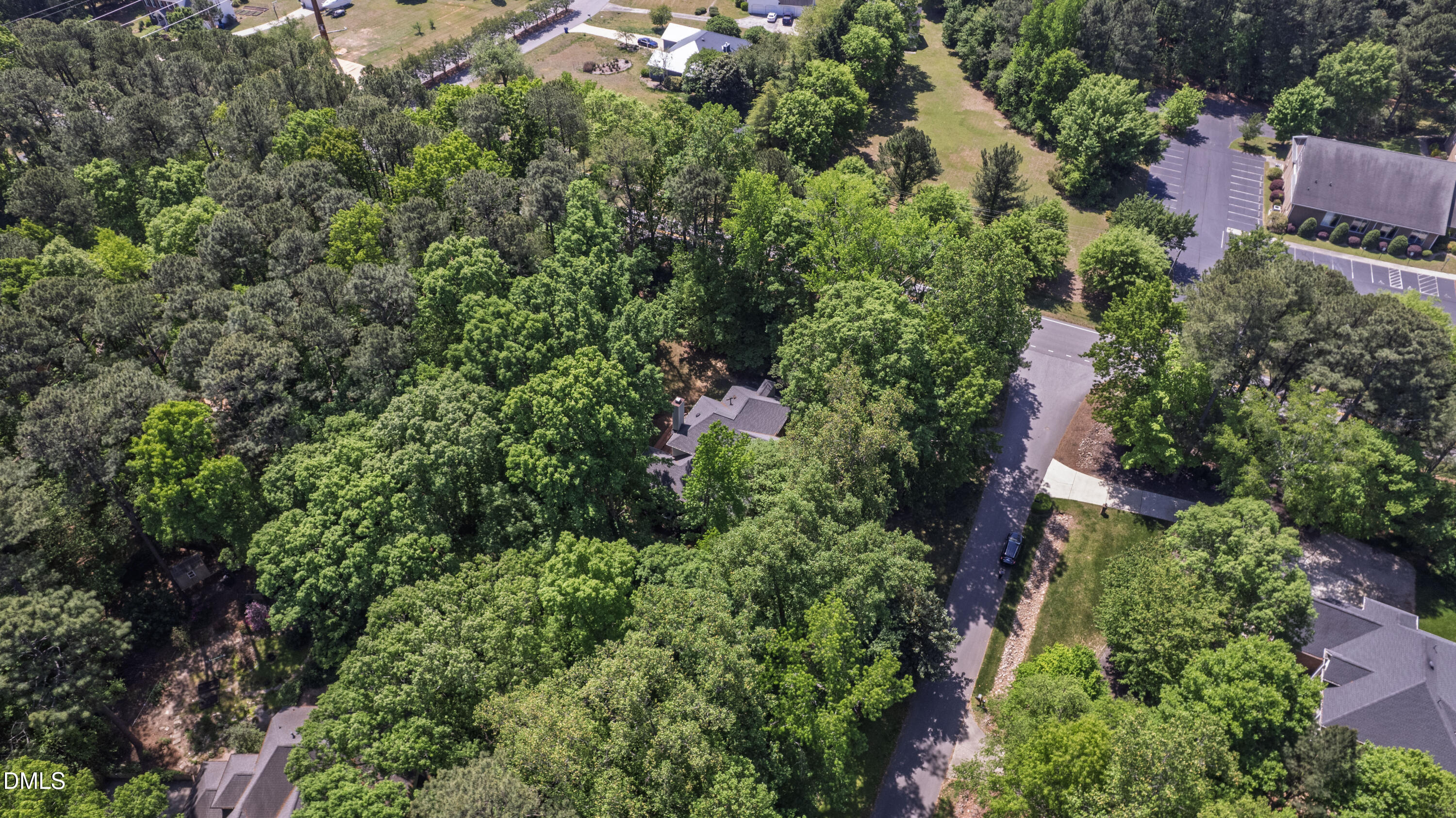 2721 Glassman Lane Raleigh, NC 27606 - Photo 71 of 74 an aerial view of residential house with outdoor space and trees all around