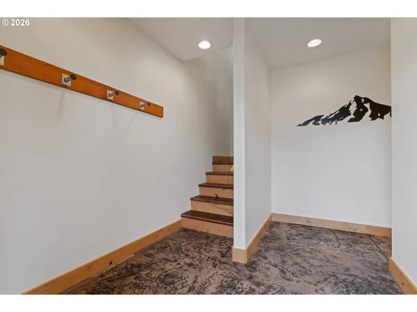 a view of a hallway with stairs