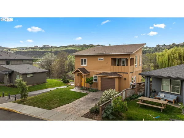 a living room with furniture and large windows