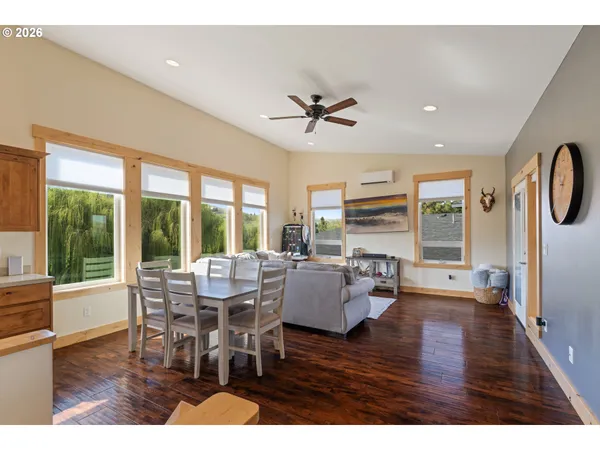 a view of a dining room with furniture window and wooden floor