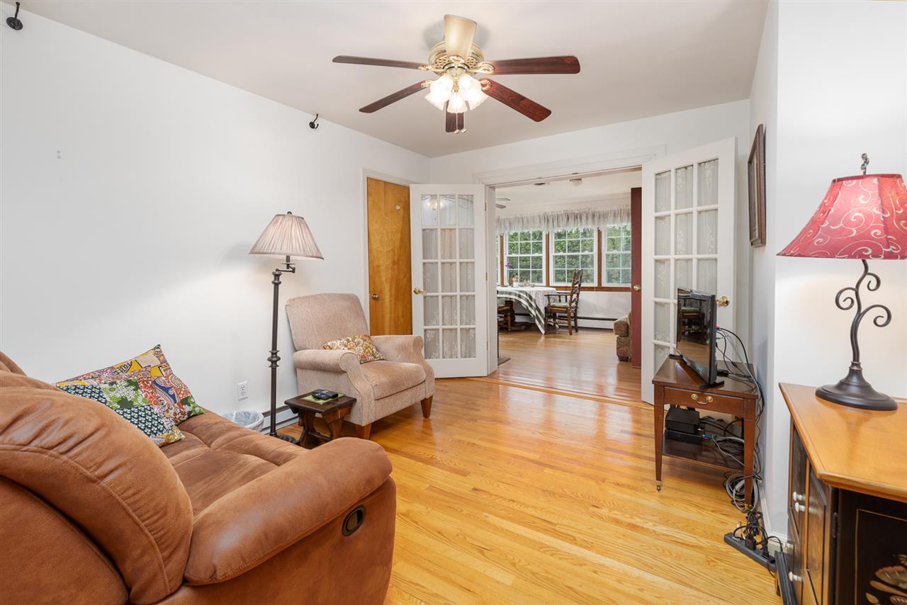 235 Overlook Road Staunton, VA 24401 - Photo 11 of 37 a living room with furniture a fireplace and a flat screen tv