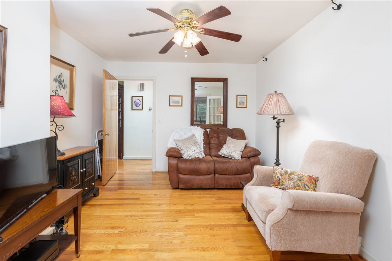 235 Overlook Road Staunton, VA 24401 - Photo 12 of 37 a living room with furniture a desk and a flat screen tv