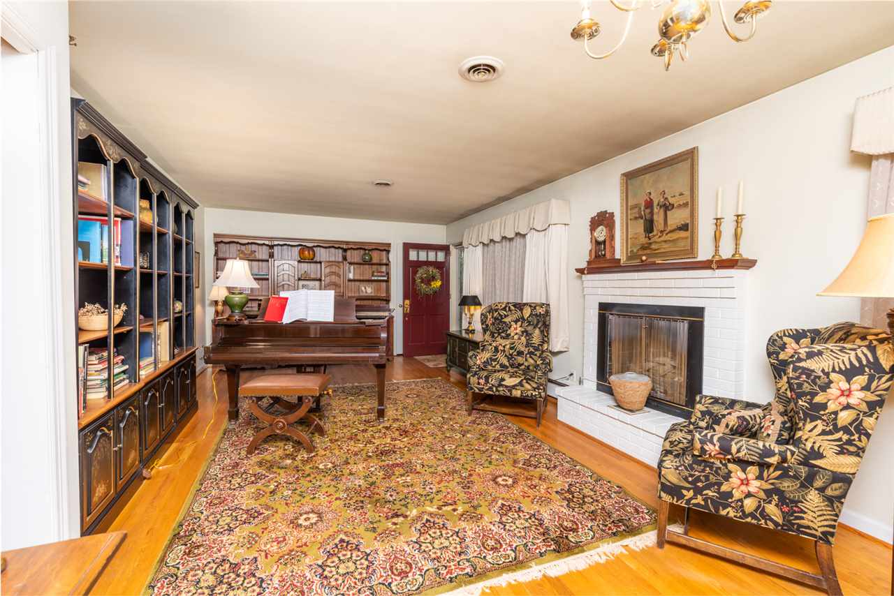 235 Overlook Road Staunton, VA 24401 - Photo 5 of 37 a living room with furniture fireplace and book shelf