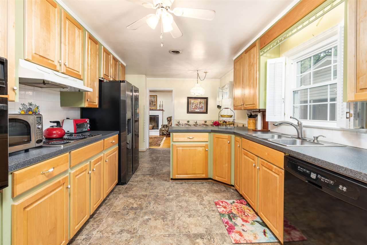 235 Overlook Road Staunton, VA 24401 - Photo 7 of 37 a kitchen with stainless steel appliances granite countertop a sink refrigerator and cabinets