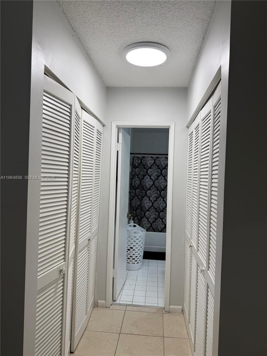 7440 Southwest 153rd Court, Unit 2014 Miami, FL 33193 - Photo 20 of 25 a view of wooden closet area