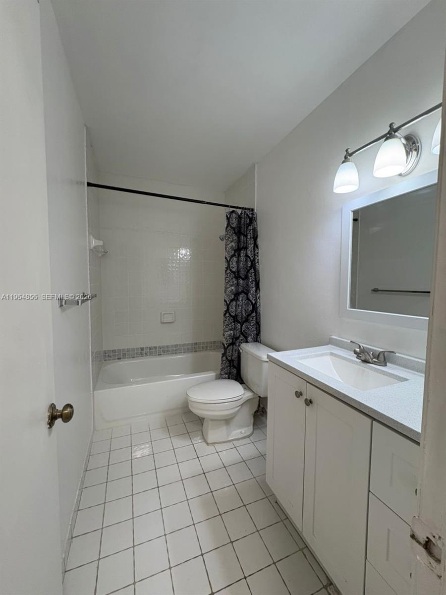 7440 Southwest 153rd Court, Unit 2014 Miami, FL 33193 - Photo 21 of 25 a bathroom with a sink a toilet and shower
