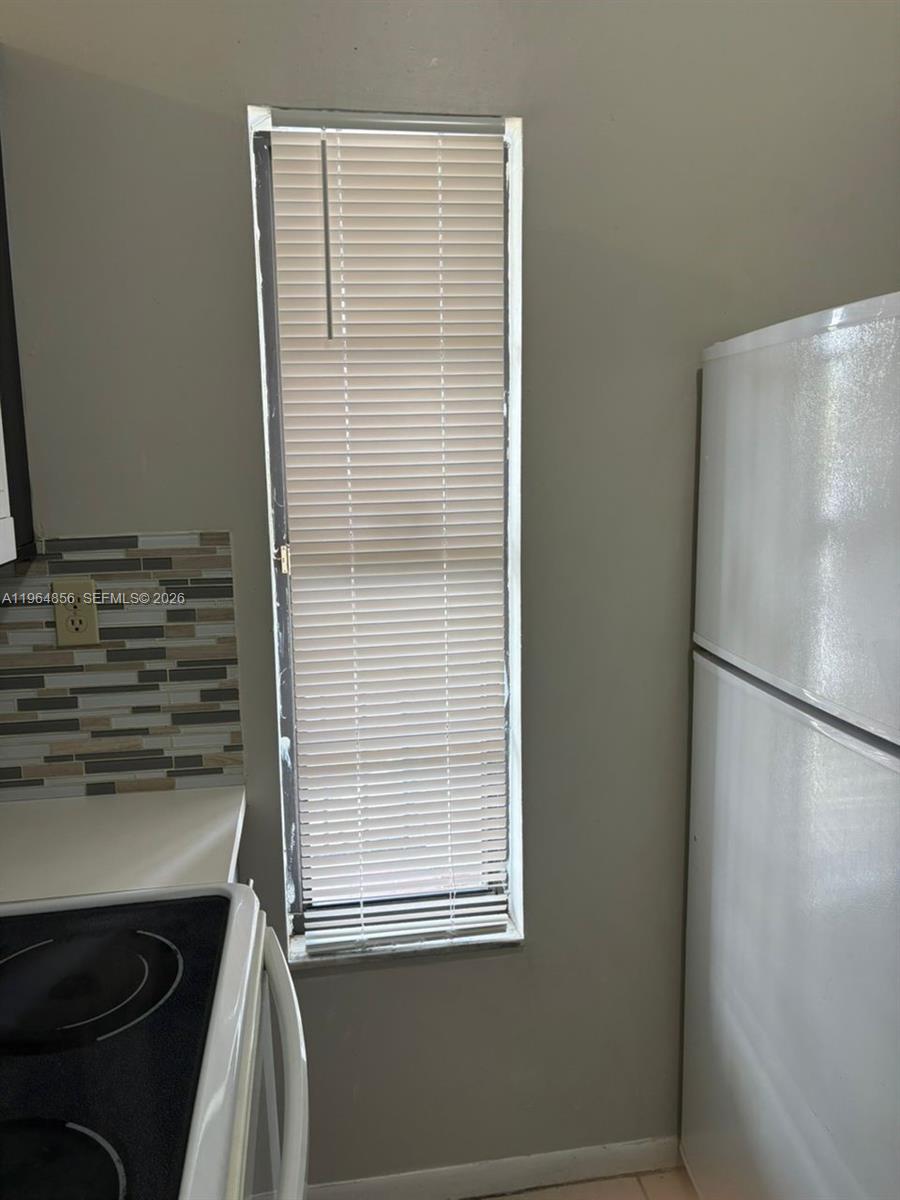 7440 Southwest 153rd Court, Unit 2014 Miami, FL 33193 - Photo 5 of 25 a view of a kitchen with a sink