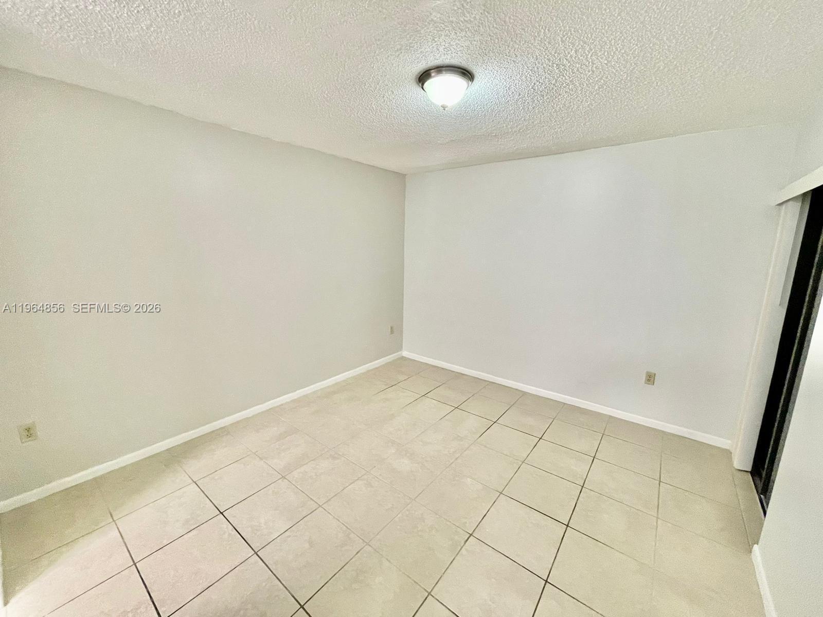 7440 Southwest 153rd Court, Unit 2014 Miami, FL 33193 - Photo 6 of 25 a view of an empty room