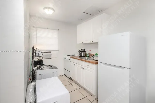a kitchen with cabinets and appliances