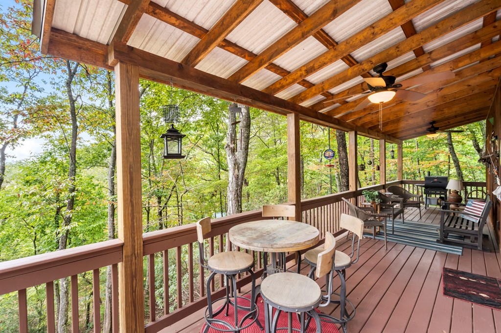 205 Copper Mountain Drive Murphy, NC 28906 - Photo 11 of 29 a outdoor dining space with furniture and wooden floor