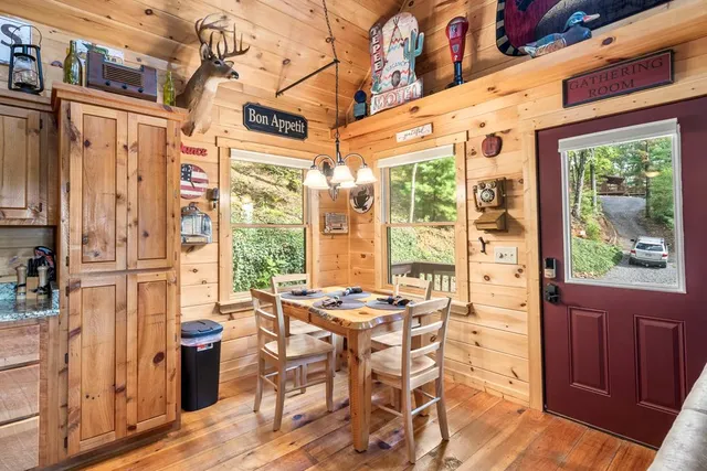 a view of a dinning table and chairs in the balcony