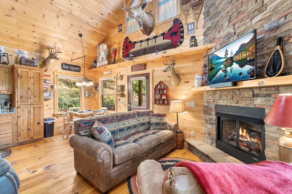 205 Copper Mountain Drive Murphy, NC 28906 - Photo 17 of 29 a living room with furniture and a fireplace