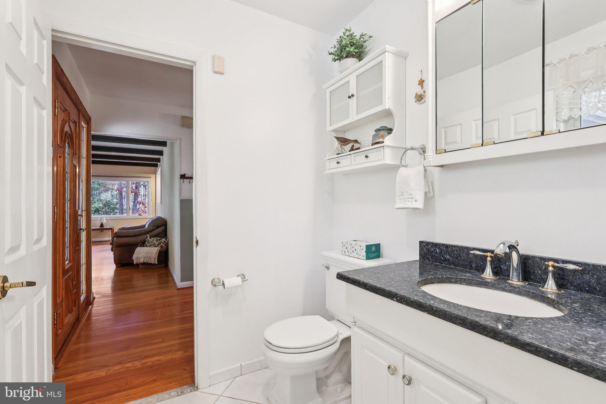 7 Pontiac Drive Medford, NJ 08055 - Photo 22 of 49 a bathroom with a granite countertop sink a toilet and a mirror