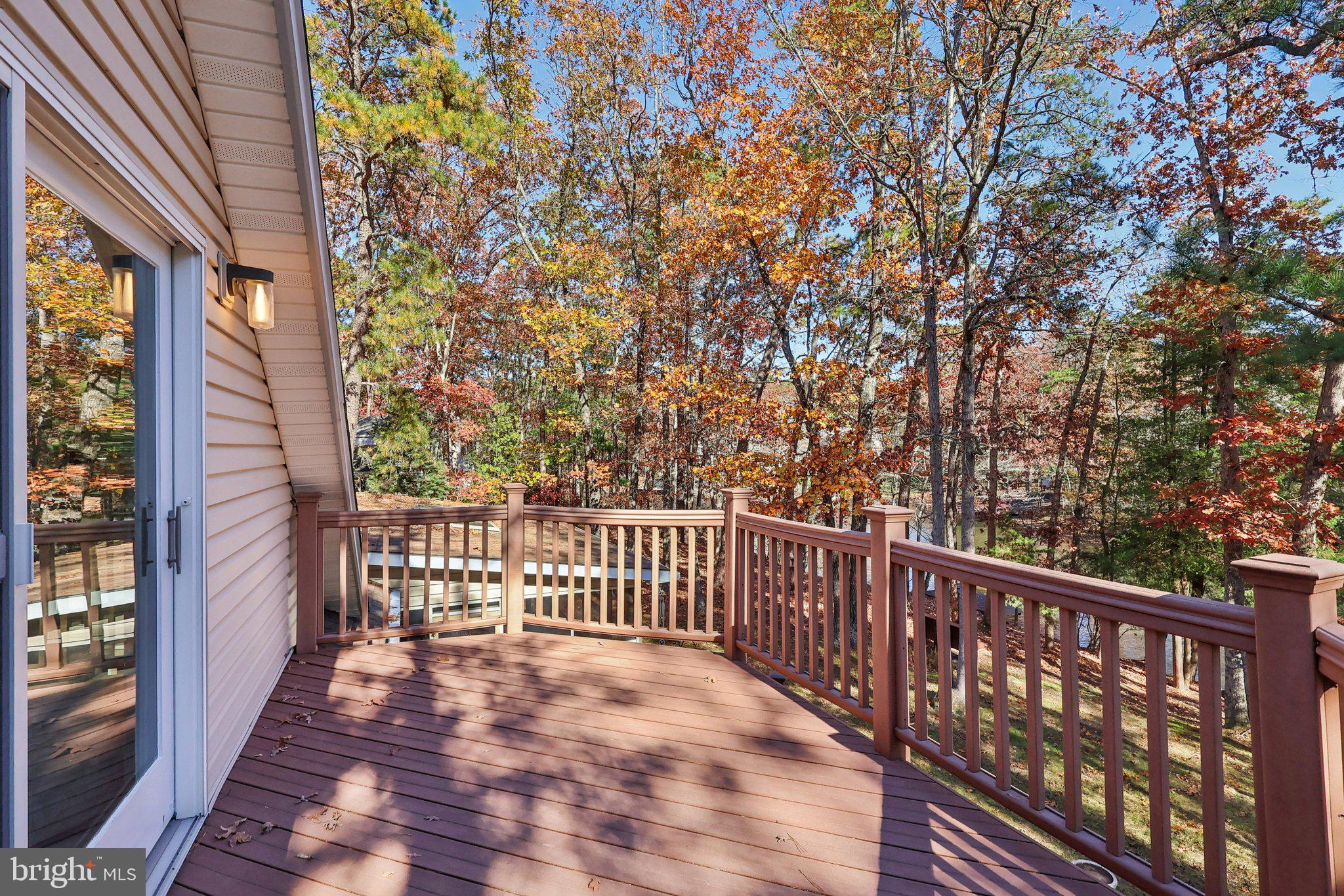 7 Pontiac Drive Medford, NJ 08055 - Photo 27 of 49 a view of a balcony with wooden floor and fence