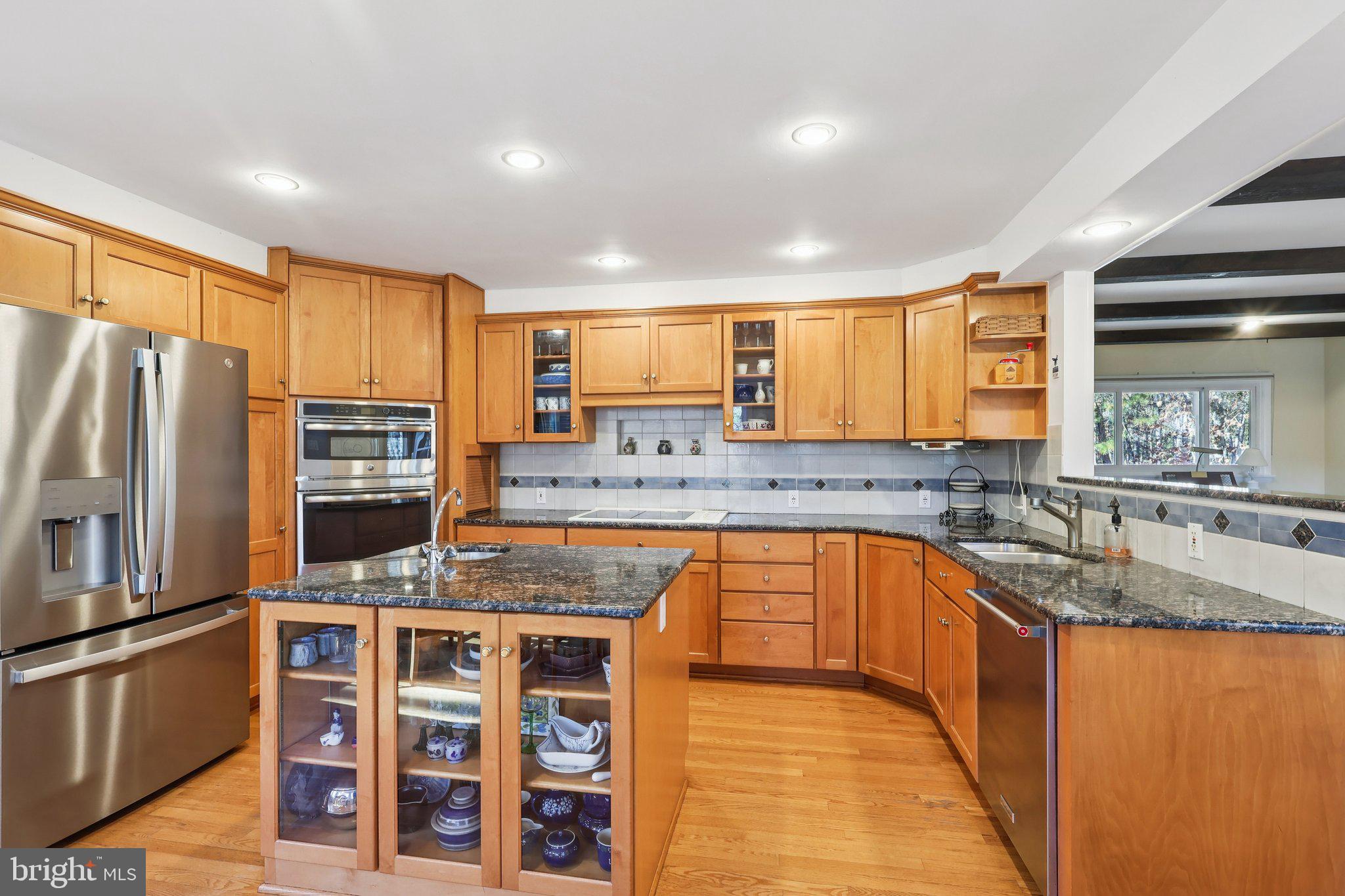 7 Pontiac Drive Medford, NJ 08055 - Photo 8 of 49 a kitchen with stainless steel appliances granite countertop a sink refrigerator and cabinets
