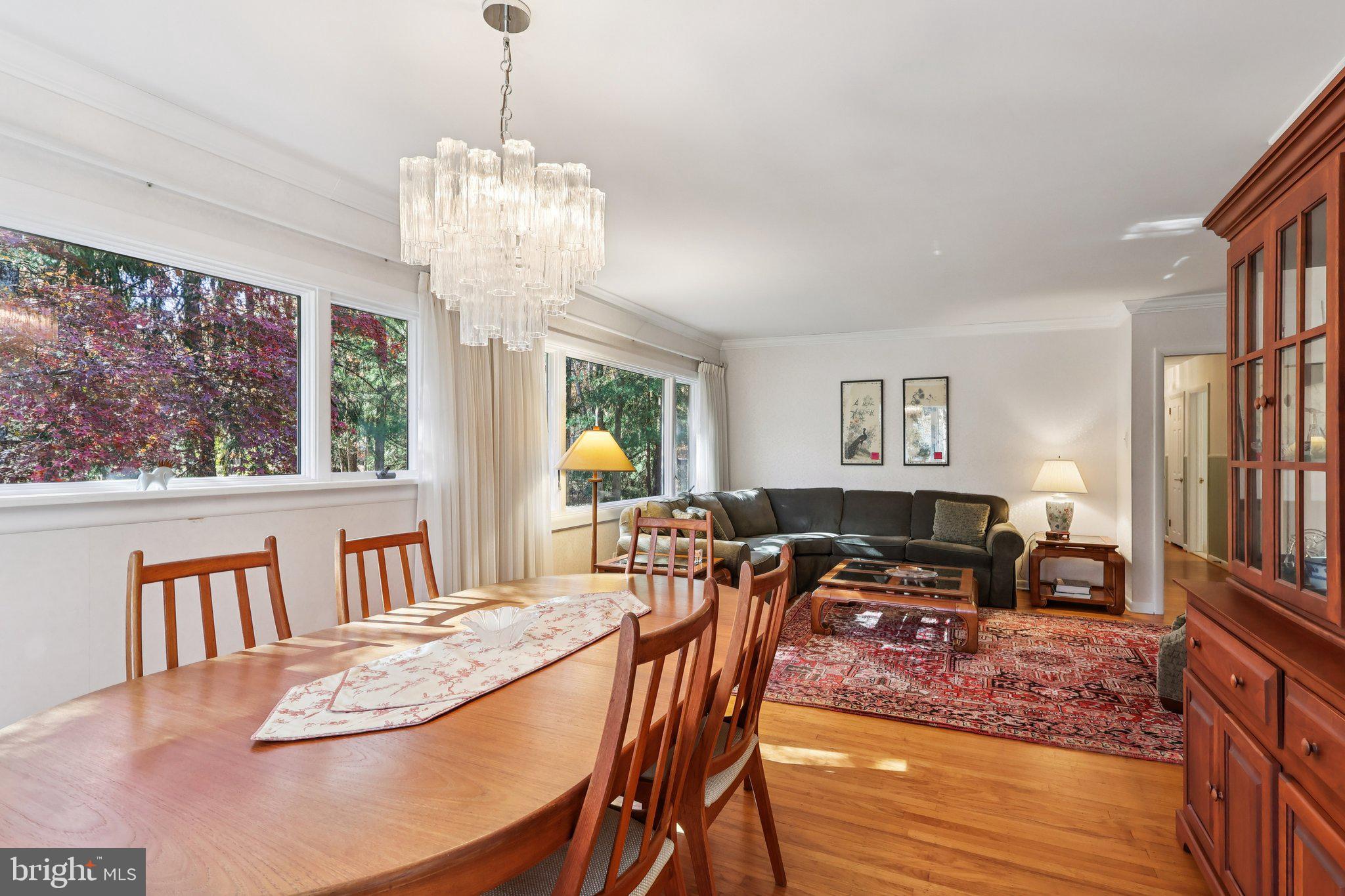7 Pontiac Drive Medford, NJ 08055 - Photo 10 of 49 a view of a dining room with furniture a chandelier and wooden floor