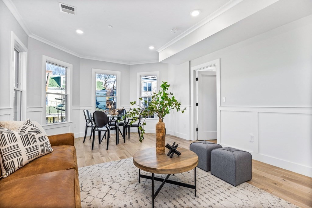 14 Hillside Park, Unit 6 Somerville, MA 02143 - Photo 11 of 32 a living room with furniture and a potted plant