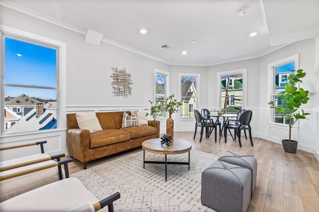14 Hillside Park, Unit 6 Somerville, MA 02143 - Photo 13 of 32 a living room with furniture potted plant and a window