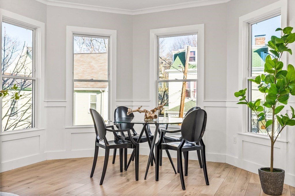 14 Hillside Park, Unit 6 Somerville, MA 02143 - Photo 15 of 32 a view of a dining room with furniture window and wooden floor
