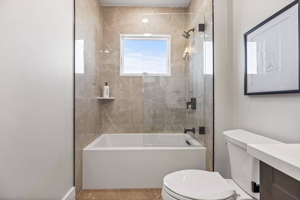 14 Hillside Park, Unit 6 Somerville, MA 02143 - Photo 17 of 32 a bathroom with a toilet and a bathtub