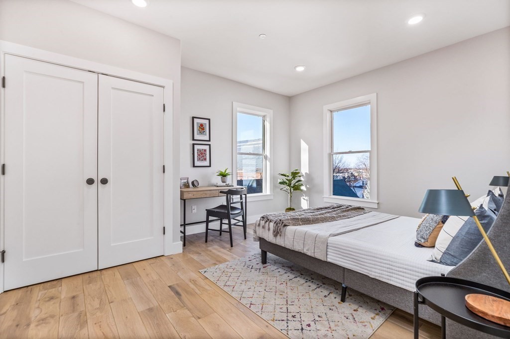 14 Hillside Park, Unit 6 Somerville, MA 02143 - Photo 18 of 32 a bedroom with a bed and a table