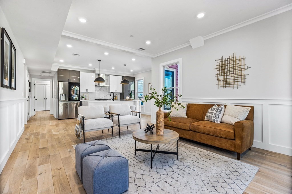 14 Hillside Park, Unit 6 Somerville, MA 02143 - Photo 9 of 32 a living room with furniture kitchen view and a table