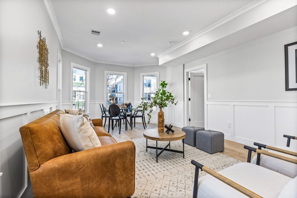 14 Hillside Park, Unit 6 Somerville, MA 02143 - Photo 10 of 32 a living room with furniture and a potted plant
