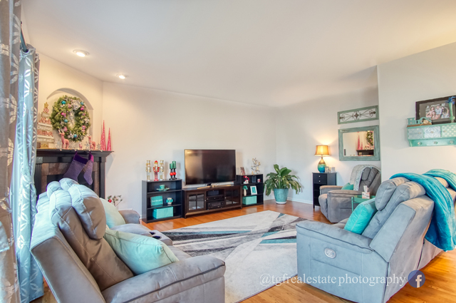 S643 Robbins Street Winfield, IL 60190 - Photo 11 of 40 a living room with furniture and a flat screen tv