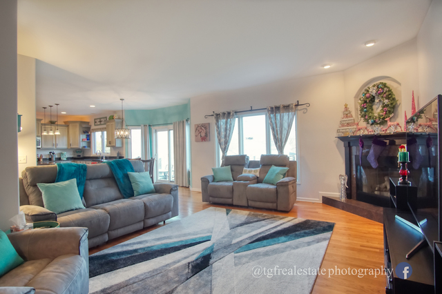 S643 Robbins Street Winfield, IL 60190 - Photo 12 of 40 a living room with furniture and a fireplace