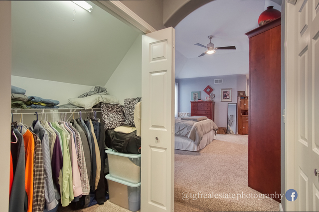 S643 Robbins Street Winfield, IL 60190 - Photo 18 of 40 a view of walk in closet with clothes and shoes
