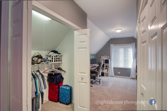 S643 Robbins Street Winfield, IL 60190 - Photo 19 of 40 a view of walk in closet with clothes and shoes