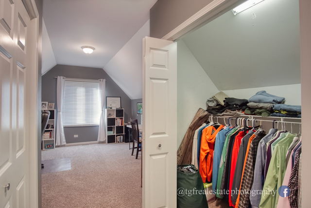 S643 Robbins Street Winfield, IL 60190 - Photo 20 of 40 a view of walk in closet with clothes and shoes
