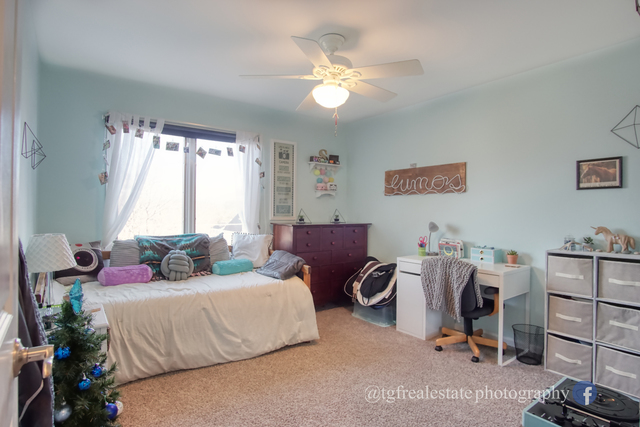S643 Robbins Street Winfield, IL 60190 - Photo 22 of 40 a bedroom with a bed furniture and a window
