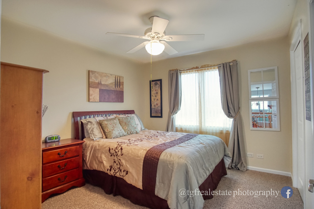 S643 Robbins Street Winfield, IL 60190 - Photo 25 of 40 a bedroom with a bed and window