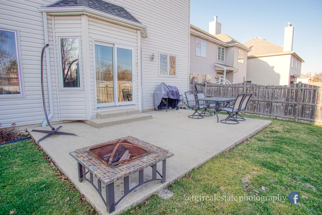 S643 Robbins Street Winfield, IL 60190 - Photo 36 of 40 a view of a house with backyard porch and sitting area
