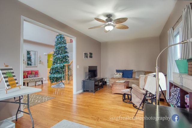 S643 Robbins Street Winfield, IL 60190 - Photo 5 of 40 a living room with furniture and a flat screen tv
