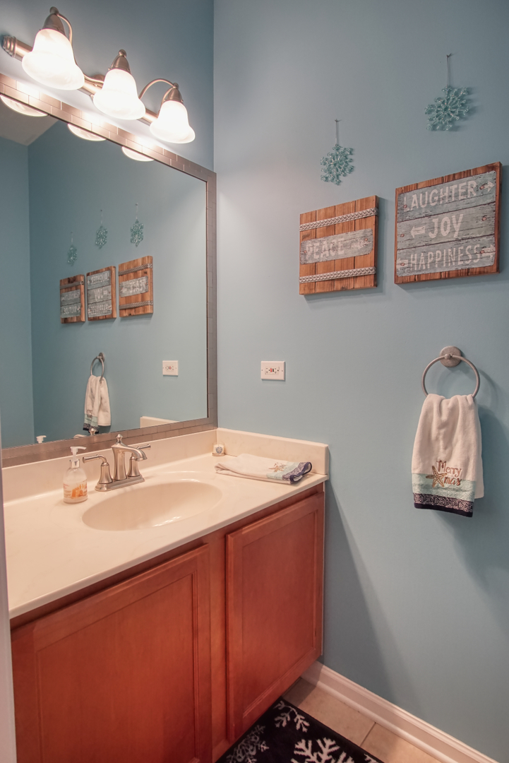 S643 Robbins Street Winfield, IL 60190 - Photo 9 of 40 a bathroom with a sink mirror and vanity
