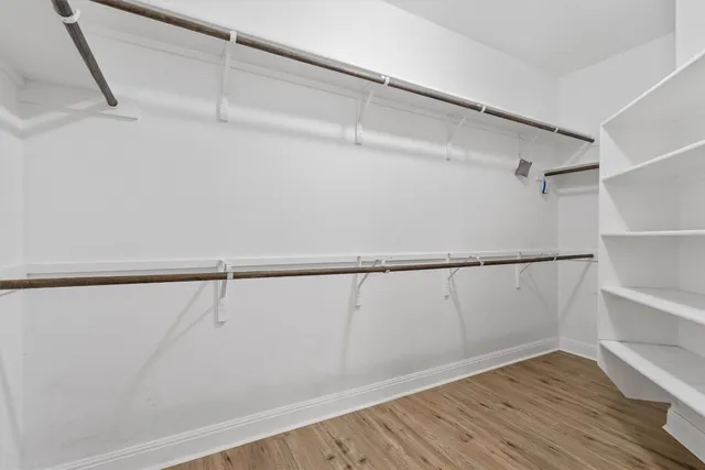 a view of an empty walk in closet