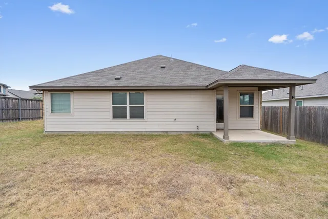 a house with trees in front of it