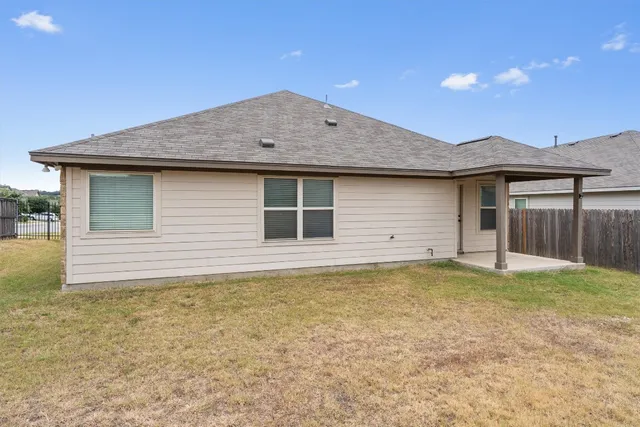 a house with yard in front of it