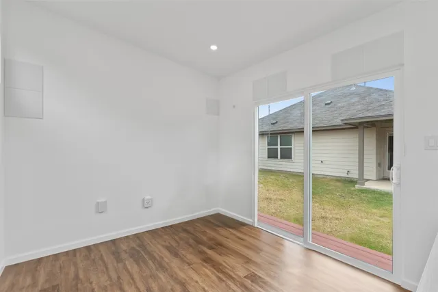a kitchen with stainless steel appliances granite countertop a refrigerator stove and sink