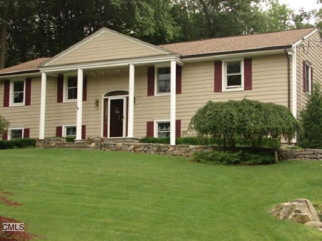 172 Winesap Road Stamford, CT 06903 - Photo 1 of 1 a front view of a house with a garden