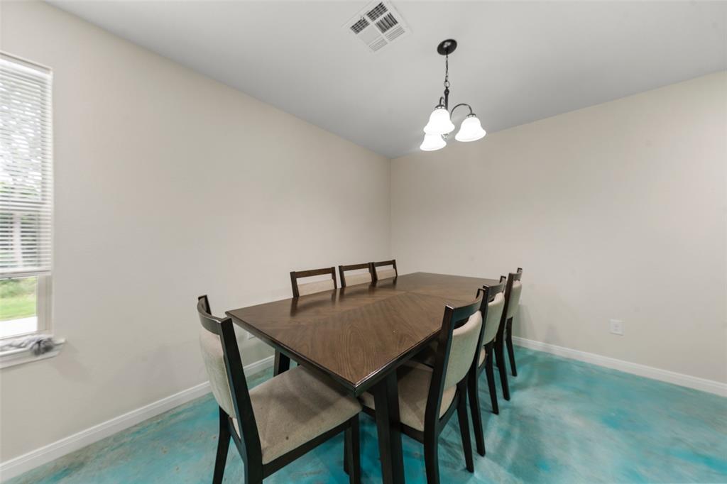 3109 North 27th Street Waco, TX 76708 - Photo 6 of 17 a view of a dining room with a table and chairs