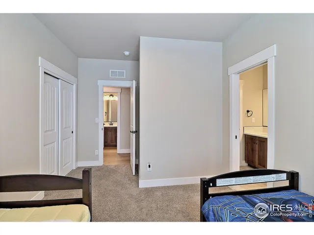 a living room with furniture and a dresser
