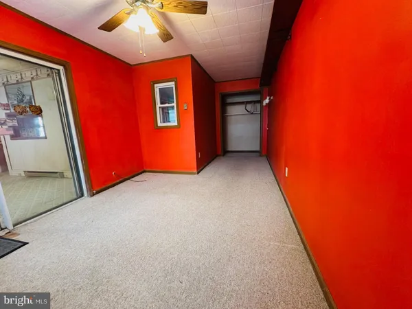 an empty room with a fireplace