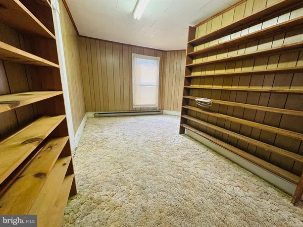 a view of an empty room with stairs