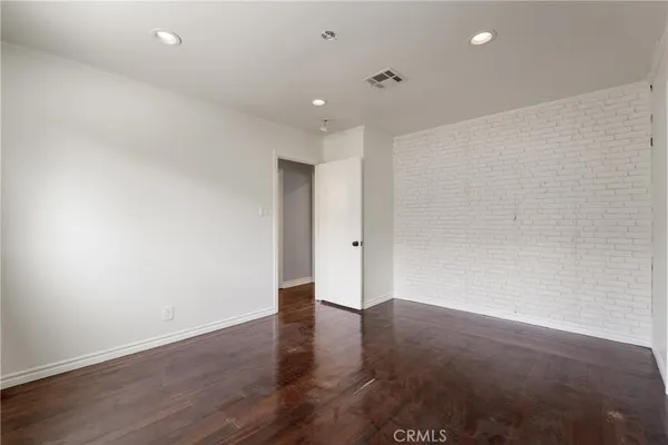 a bed room with a bed and a chair