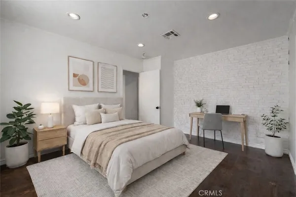 a bathroom with a sink vanity granite and toilet