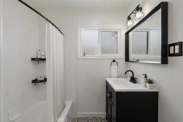 a kitchen with a sink cabinets and stainless steel appliances